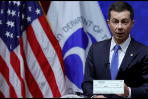 Secretary Buttigieg and check